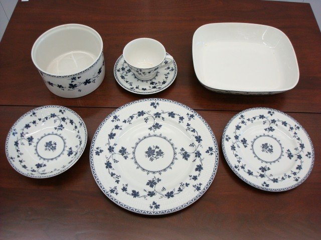 Royal Doulton Service Yorktown Pattern: Royal Doulton partial dinnerware service in the Yorktown pattern including seven dinner plates; seven cups and eight saucers; eight desserts; and eight bowls (one with a chip) . Also included in the l