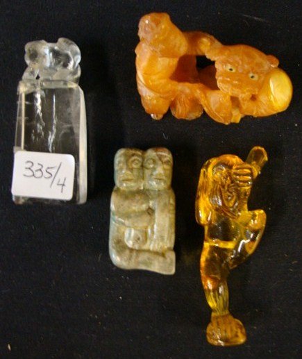 Four Misc. Chinese Items: Previously sold in our 10/15/12 auction, items were never paid for. Included is an amber netsuke with bug entrapped; a carnelian figure; a marble double figure and a rock crystal seal. Varying sizes.