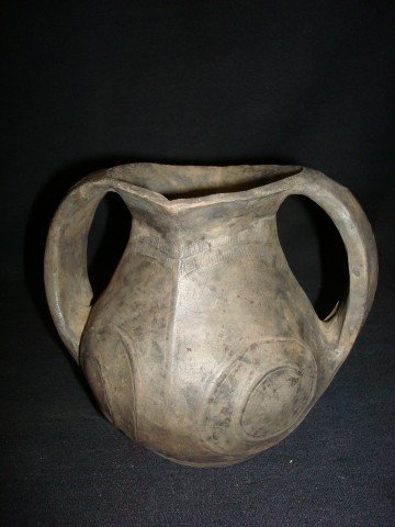 Han Dynasty Pottery Vessel: Double handled. With double sided pouring spout at the rim. Body decorations. 5 3/4"H. and W including the handles