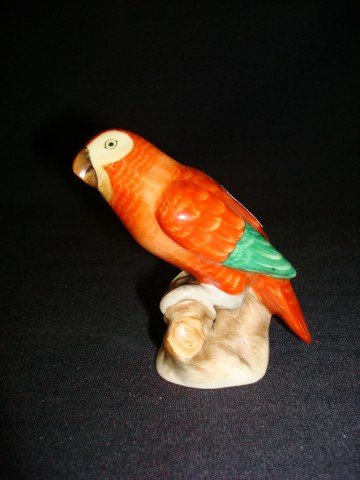 Herend Parrot Figure Signed: Well decorated Herend parrot figure. Signed on the bottom with a Herend Hungary mark, 1942. and with impressed markings; 3in. H.
