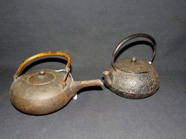 Two(2) 19thC. Japnese iron teapots: Two(2) iron teapots with floral decoration; 6.5in. H. with handle