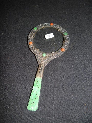 19th C. Chinese silver and jade magniflying glass: Silver magnifying glass with coral and jadeite inlay and jadeite handle. Collapsible hinged handle. Original box; 6.25in.