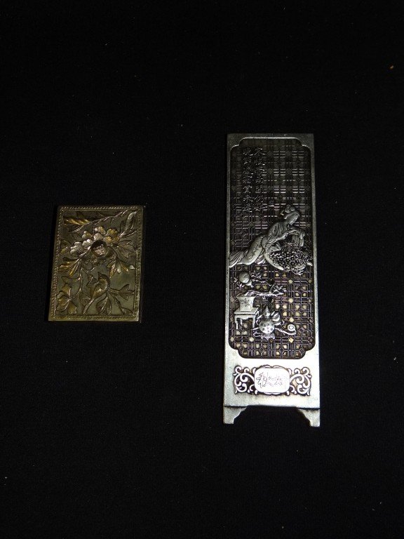 Two(2) Chinese sliver pieces: Silver scroll weight, 5.75in. H. x 1.75in. W. ; pill box with raised bird decoration, 2-3/8in. X 1.75in.