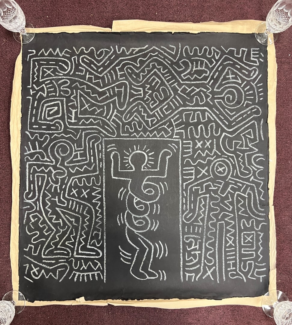 Keith Haring Drawing: Black Drawing Paper mounted on brown paper. 31"H. x 29"W. No signature found.