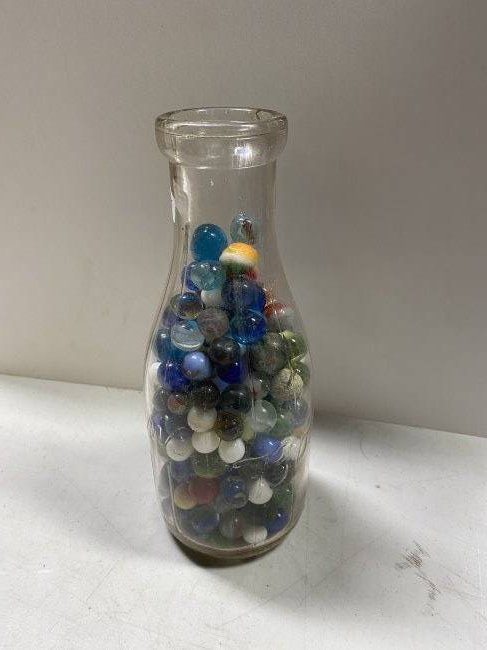 Borden's 1 Quart Milk Bottled Filled with Marbles.: Varying types, varying sizes.