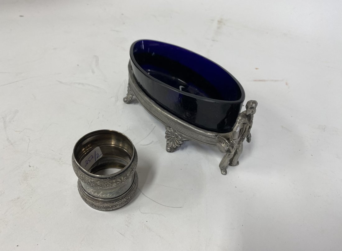 American Victorian Cobalt Server & Napkin Ring (2): American Victorian New England Silver plated figural server, perhaps a sailor with hat in hand, , at the forefront of the footed holder for the cobalt glass bon bon. 6 1/2|L x 2 1/4"H Included in the