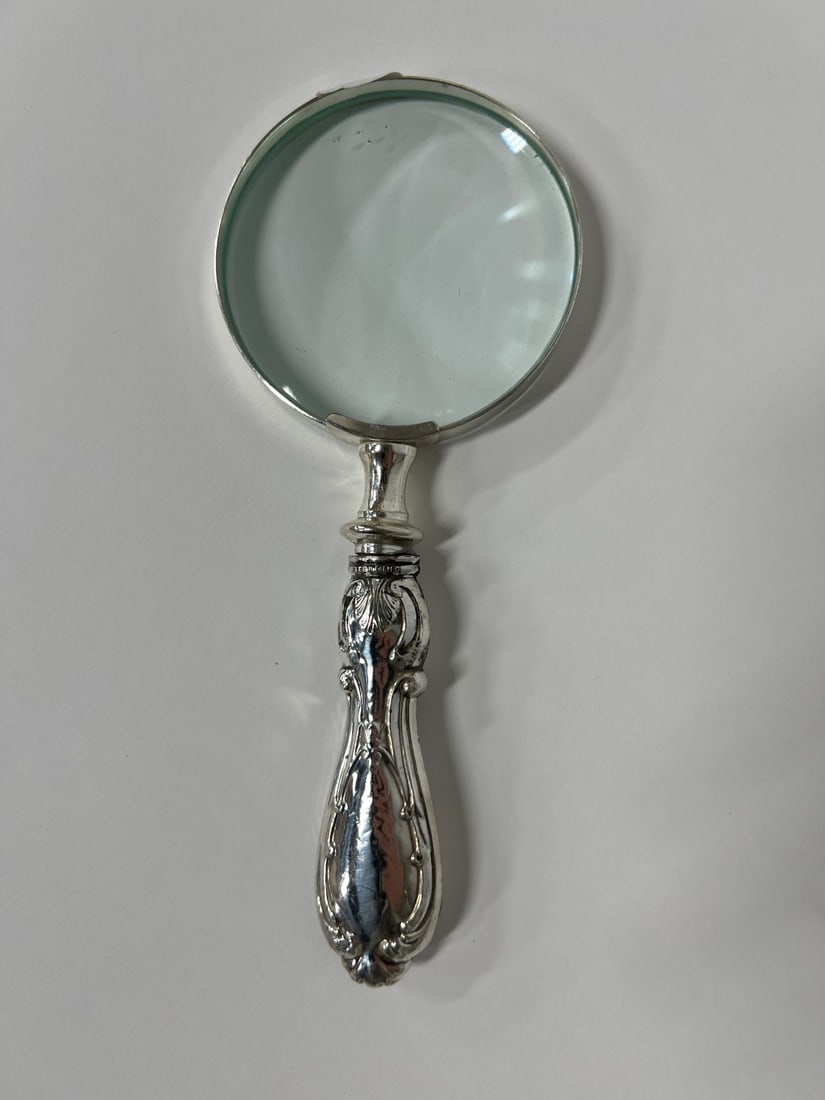 Sterling Silver Magniftying Glass: Marked Sterling on the handle. 7 1/2"L