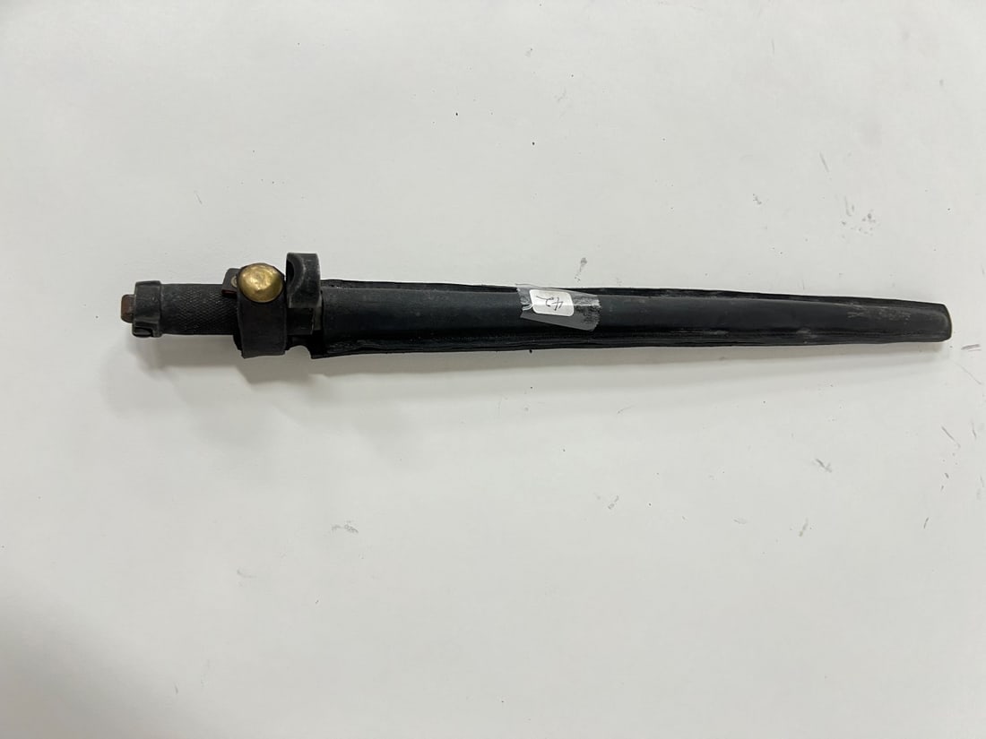 Russian Bayonette: With loop for wearing on a belt. Sheath with brass button enclosure. 15 1/2"L