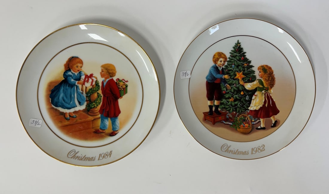 Collectible Christmas Plates 1982 and 1984 22K Gold Trim (2): Christmas Memories and Celebrate the Joy of Giving. 22K Gold trim. For Avon. Two in the lot.9 1/2"D