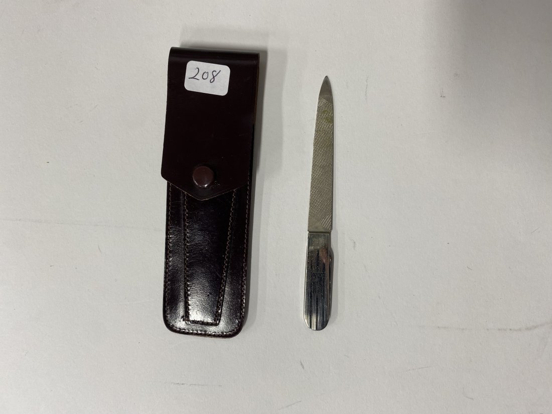 Sterling Silver Handled Art Deco File: Marked Sterling. In original leather case marked Cordovan. 5"L (case size)