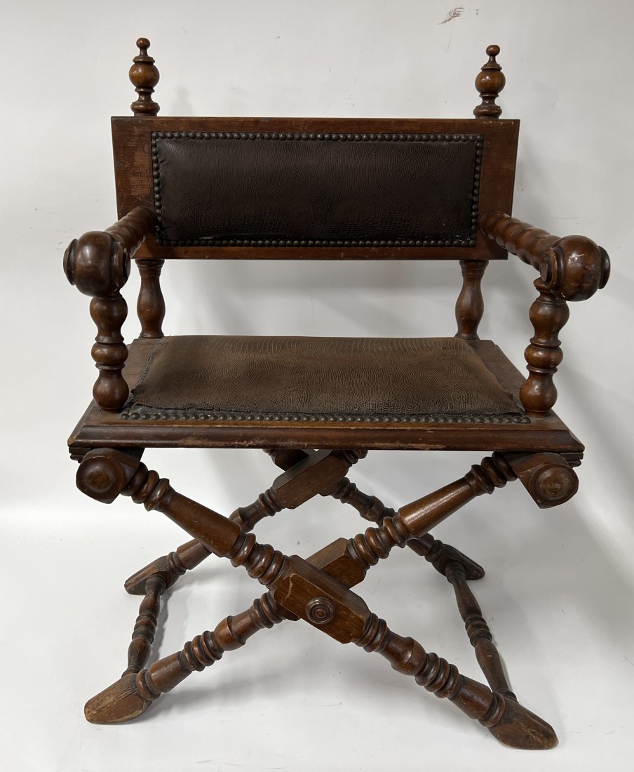 English Jacobean Carved and Leather Chair: Rope twisted arms. Leather back panel with brass stud surround and leather cushion with brass stud surround 36.5"H x 24"W