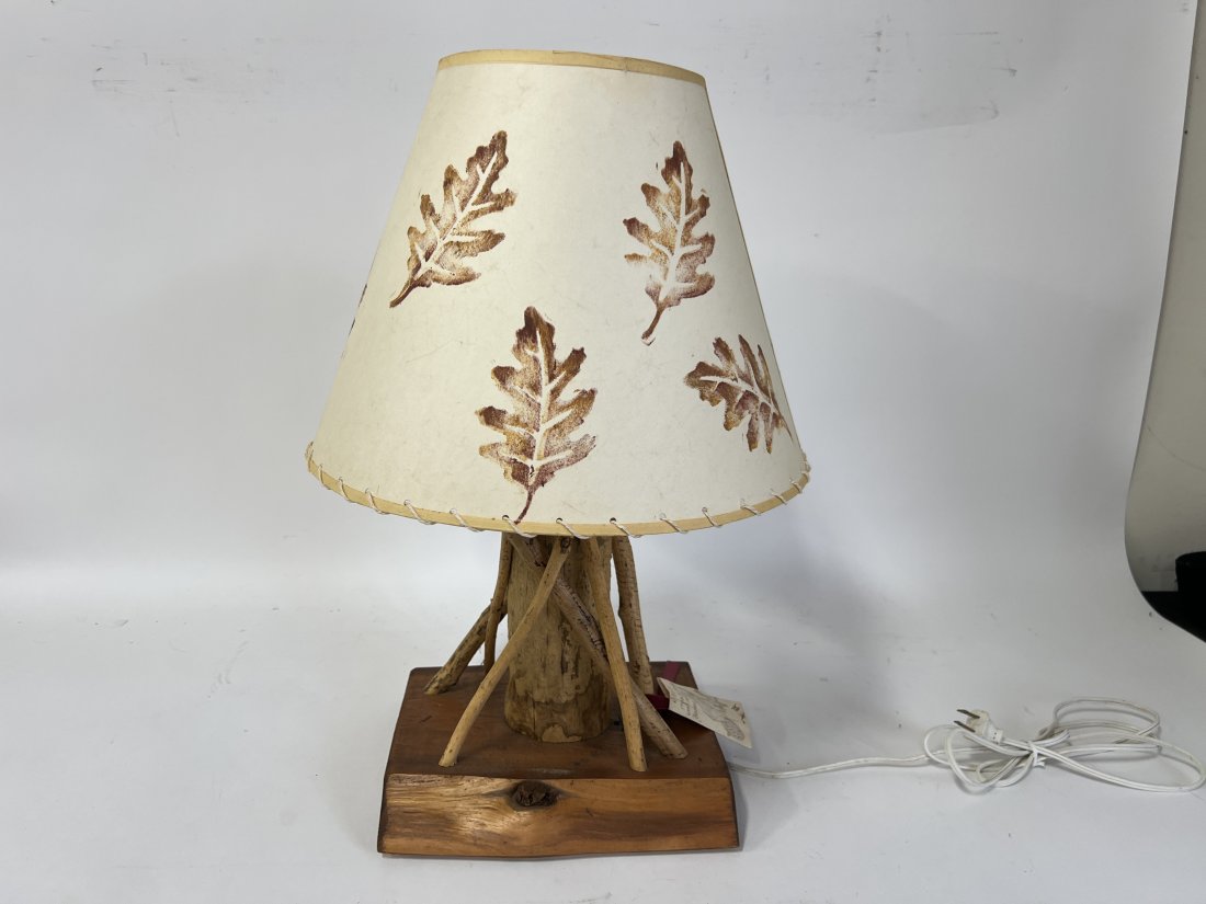 Adirondack tree Bark Lamp: Natural wood base. Original shade with leaf decorations. Has tag "Made by Adirondack wood gnawed by beavers" 16"H
