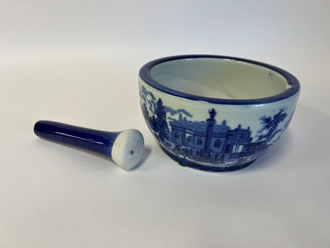 English Staffordshire Blue and White Mortar & Pestle: Marked at the underside: Victoria Ironstone. Bowl is 4"H x 8" Diameter. Pestle is 6.5" Long