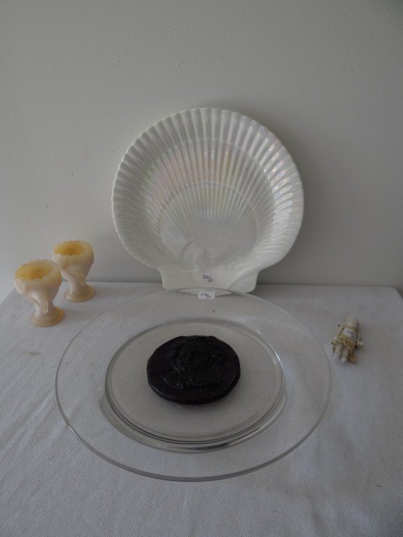 Collectors Lot of Antiques inc. Daum plate: Two figural egg cups; a Wedgwood Nautilus Lustre shell plate; a Daum France glass plate with an amethyst Beethoven plaque at the center and small china doll house doll (as is) 10" to 4"