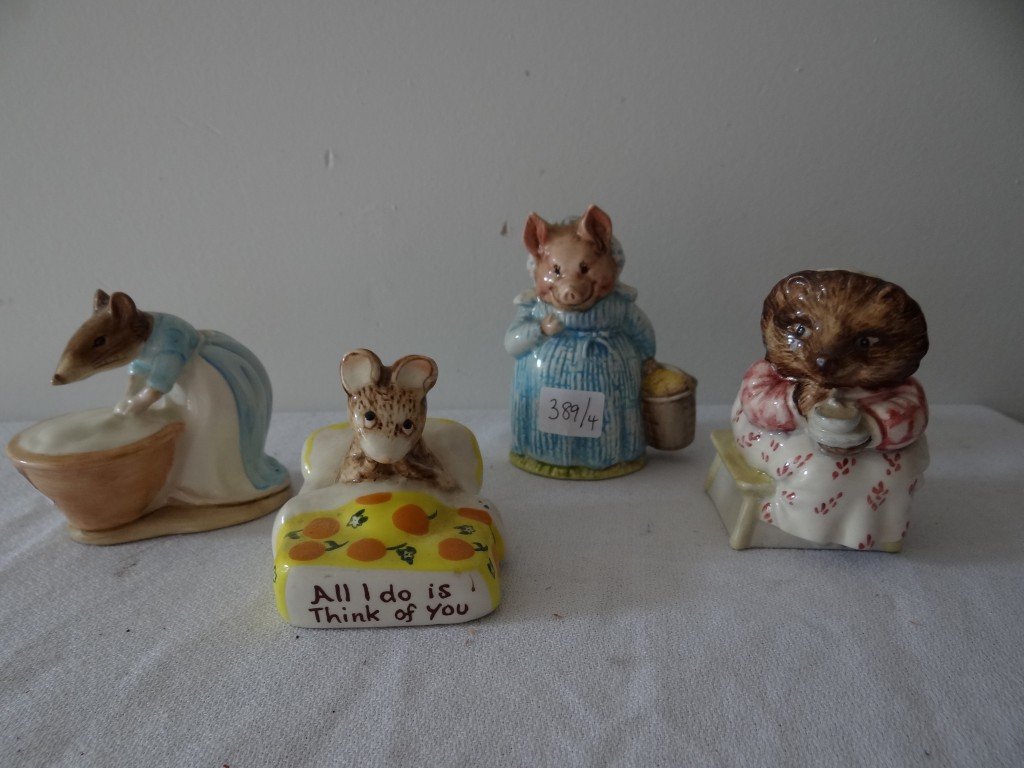 Beswick Figures (4): Kitty MacBride; Mrs. Tiggy Winkle; Aunt Pettitoes; Anna Maria. Four in the lot. 2 3/4"H. to 3 3/4"H.