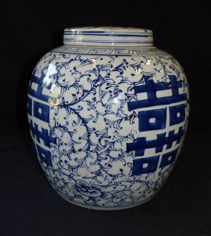 Chinese porcelain Ginger Jar: Porcelain ginger jar decorated in blue and white. Straw mark impressions at the underside; 12in. H.