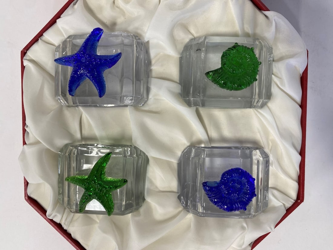 Hans Turnwald Art Glass Seaside Napkin Rings: Hans Turnwald best quality glass napkin rings with seaside art glass motif mounts, star fish and snails. In the original box marked Hans Turnwald at the inside of the box. Signature Collection, Paris,