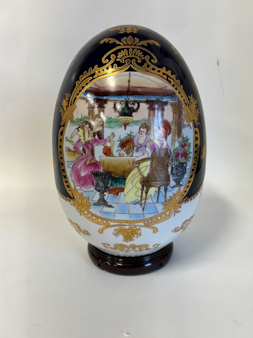 French Porcelain Hand Painted "Egg" Sculpture: On teakwood stand. 16"H 9"W