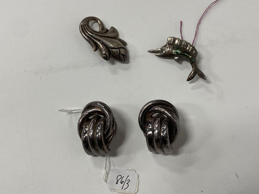 Antique Sterling Silver Jewelry inc. Mexican: Mexican sterling silver and inlaid gemstone whale pin; an oversized pair of Sterling silver earrings (clip) and a sterling floral brooch. Three items in the lot.