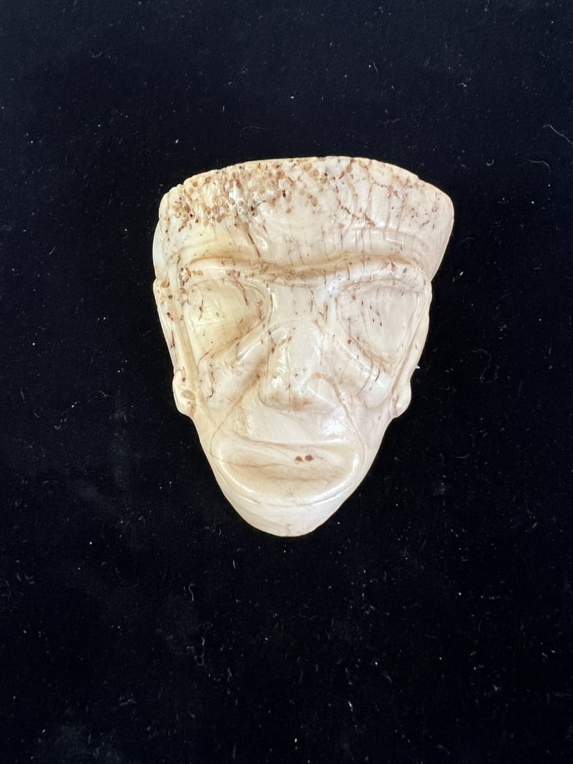Taino Carved Shell Mask: Carved white shell Taino mask. Caribbean Islands 1000-1500 AD Provenance French Collection. 3"H x 2.5"W