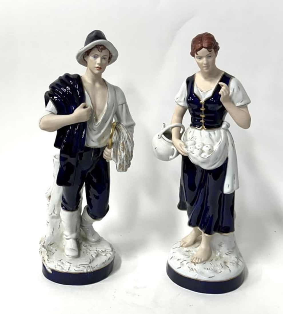 Pair of Fine Antique Royal Dux Figures: Man and Woman. Each marked Royal Dux at the underside.