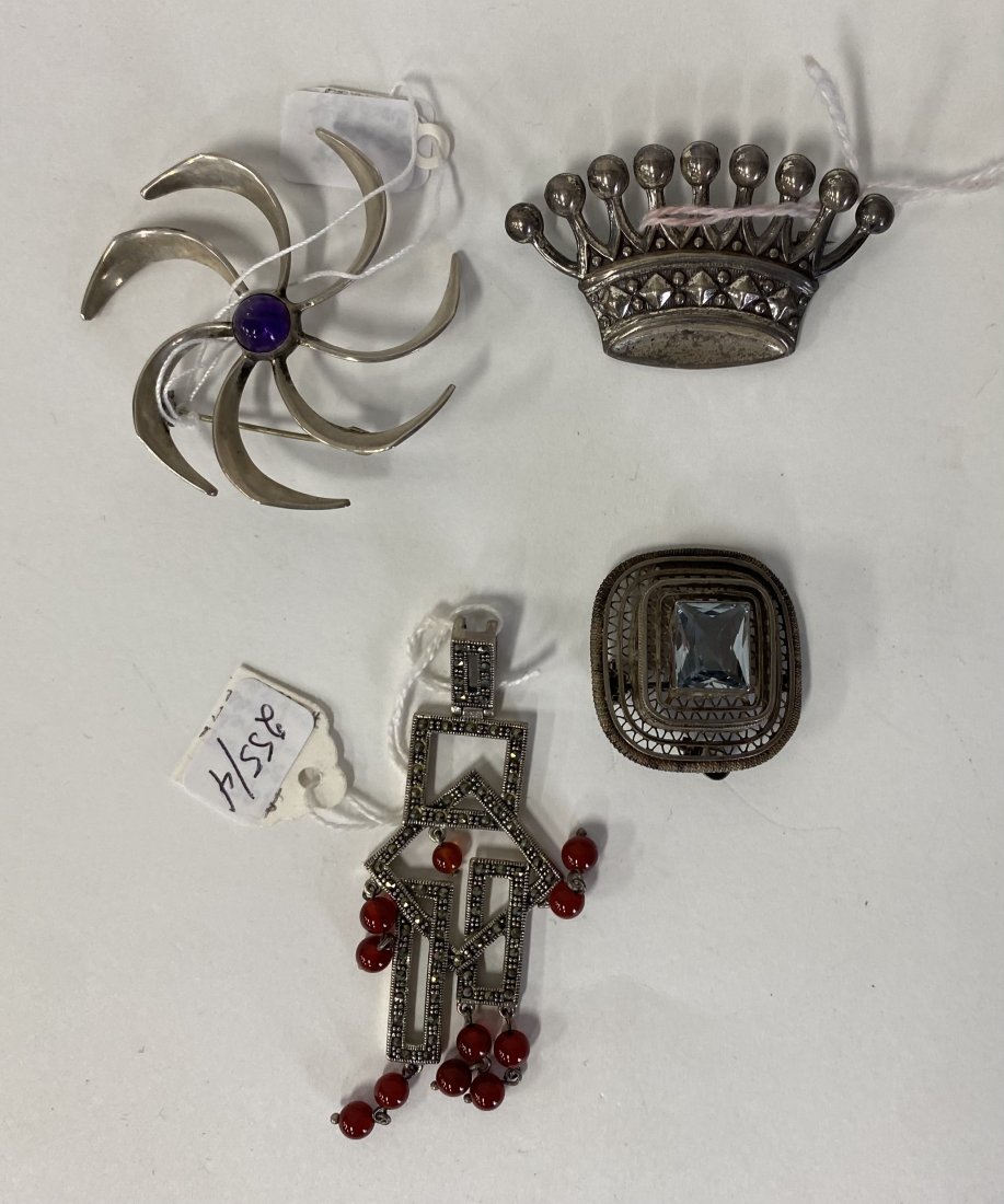 Colelctor or Dealer's Lot of Sterling Jewelry (4): Sterling Silver and Amethyst brooch marked 925 and with several maker's, artists and other marks; sterling silver, carnelian and marcasite pendant marked 925; sterling silver crown pendant marked ster