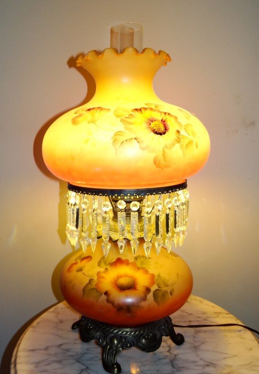 Gone With the Wind Parlor Lamp: Painted shade and base. Hanging cut glass prisms on an ornate brass four footed base. 25"H.