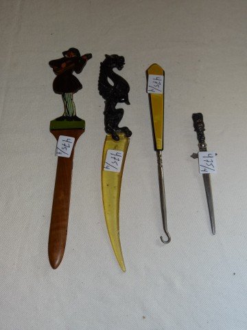 Two Collectible Letter Openers: One a Bavarian hand painted figural letter opener; and one a collectible lucite figural one.The lot also includes an art deo button hook and a small letter opener Letter openers are 9"L