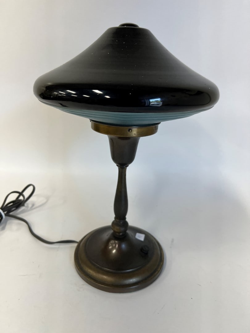 Rare Black Shade Emeralite Lamp: For war-time use as light glows down. The purpose; enemy planes would not be able to see as light is hidden. Signed "Emeralite". The history: first Emeralite turned on 1909. Engineer: Harrison D. McFa