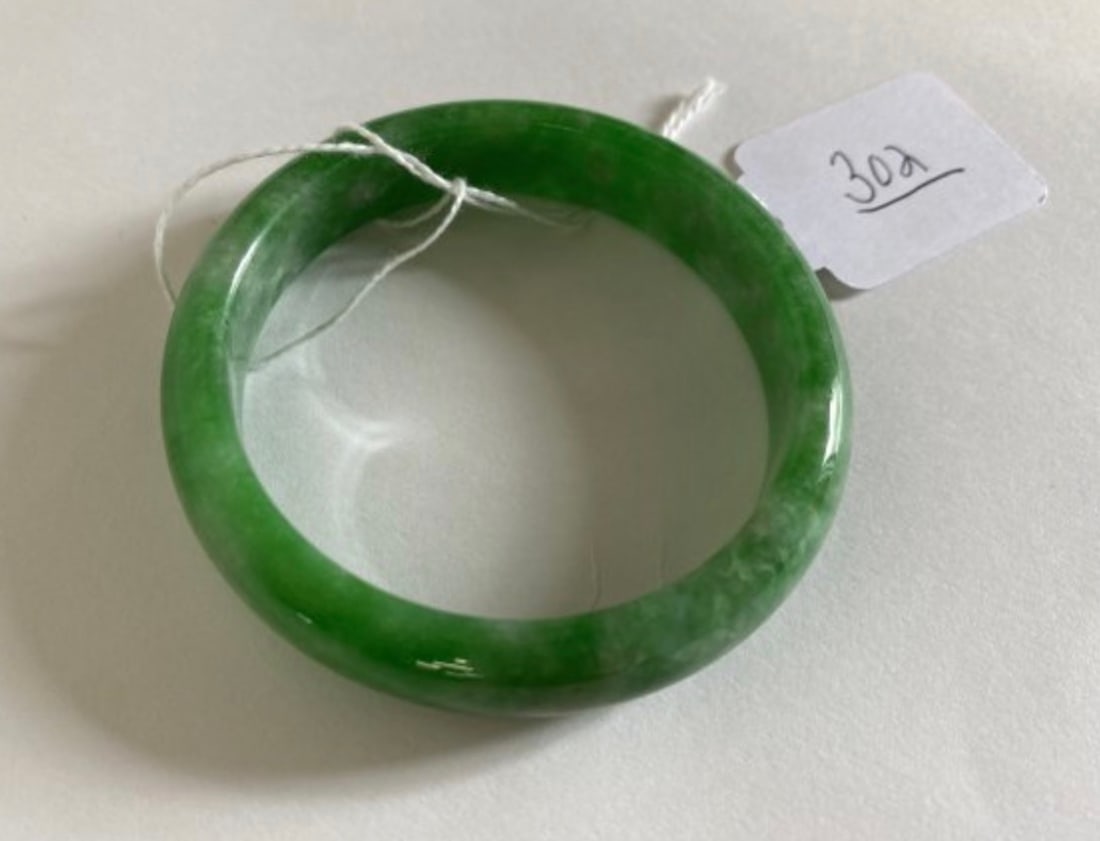 Top Grade Burma Emerald Jadeite Bracelet: Size, color, Consistency, Carving, Polish and condition , this exceptional one has it all.
