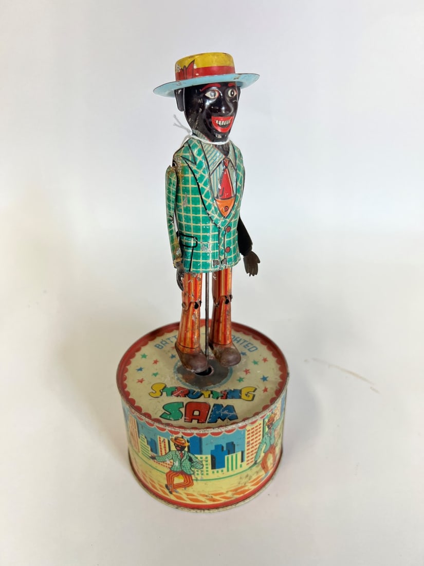 Strutting Sam. Vintage Toy. Works: Lithographed toy. 11 1/2"H x 4 1/2"W
