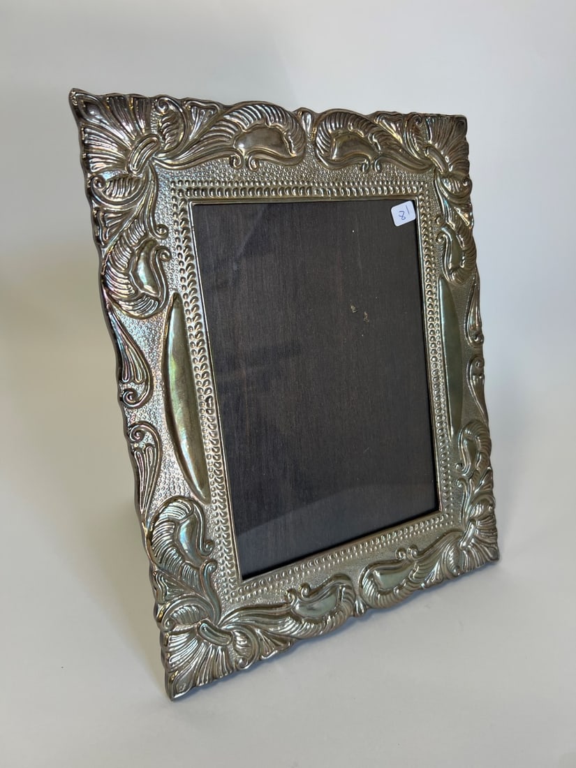Sterling Silver Repoussed Fancy Frame: 13"H x 10 1/2"W Visible glass is 9"H x 6 1/4"W Marked 925