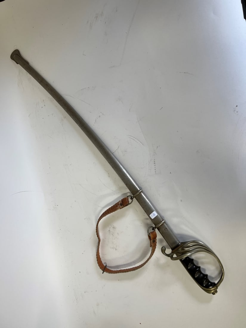Antique Sword in Sheath: Marked France U S E Pluribus Unim R. Dabock & Co. NY on the blade. 38"L. Fancy engravings on blade.