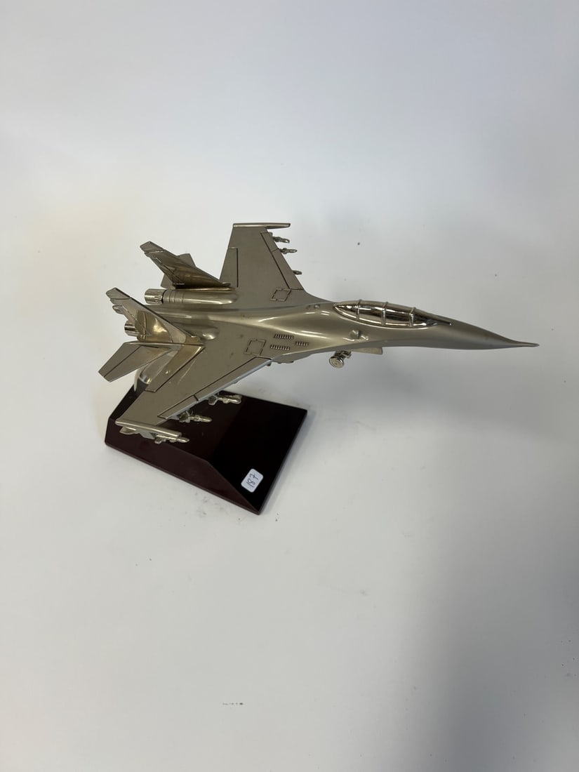 Fighter Jet on Stand: Metal on wooden base. 9" tall. Jet is 12" long.