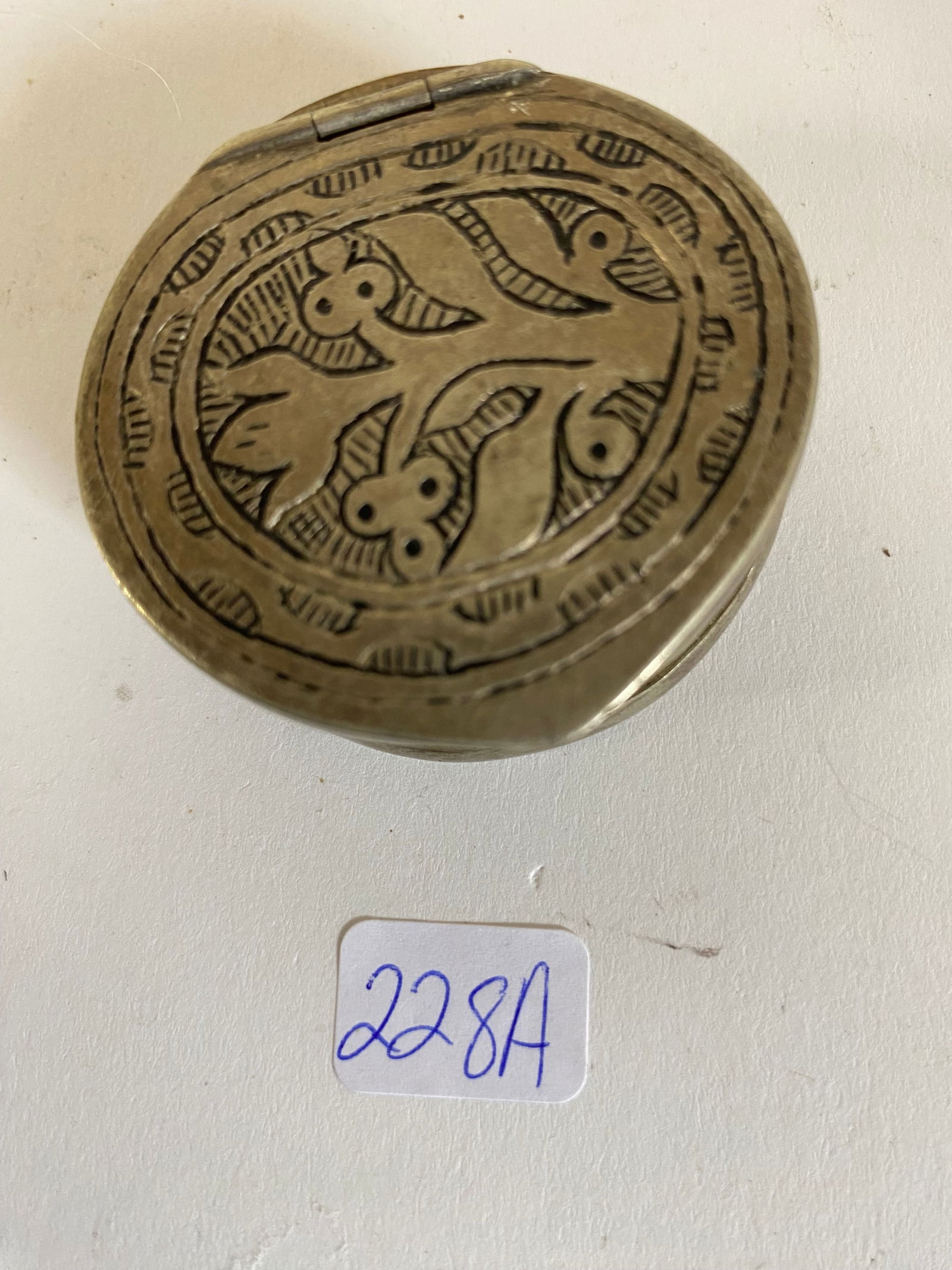 Fine Early Silver Pill Box: European, in high grade silver, with bold floral design. On opening it reveals a hidden compartment in worked silver. Heavy and in fine condition,