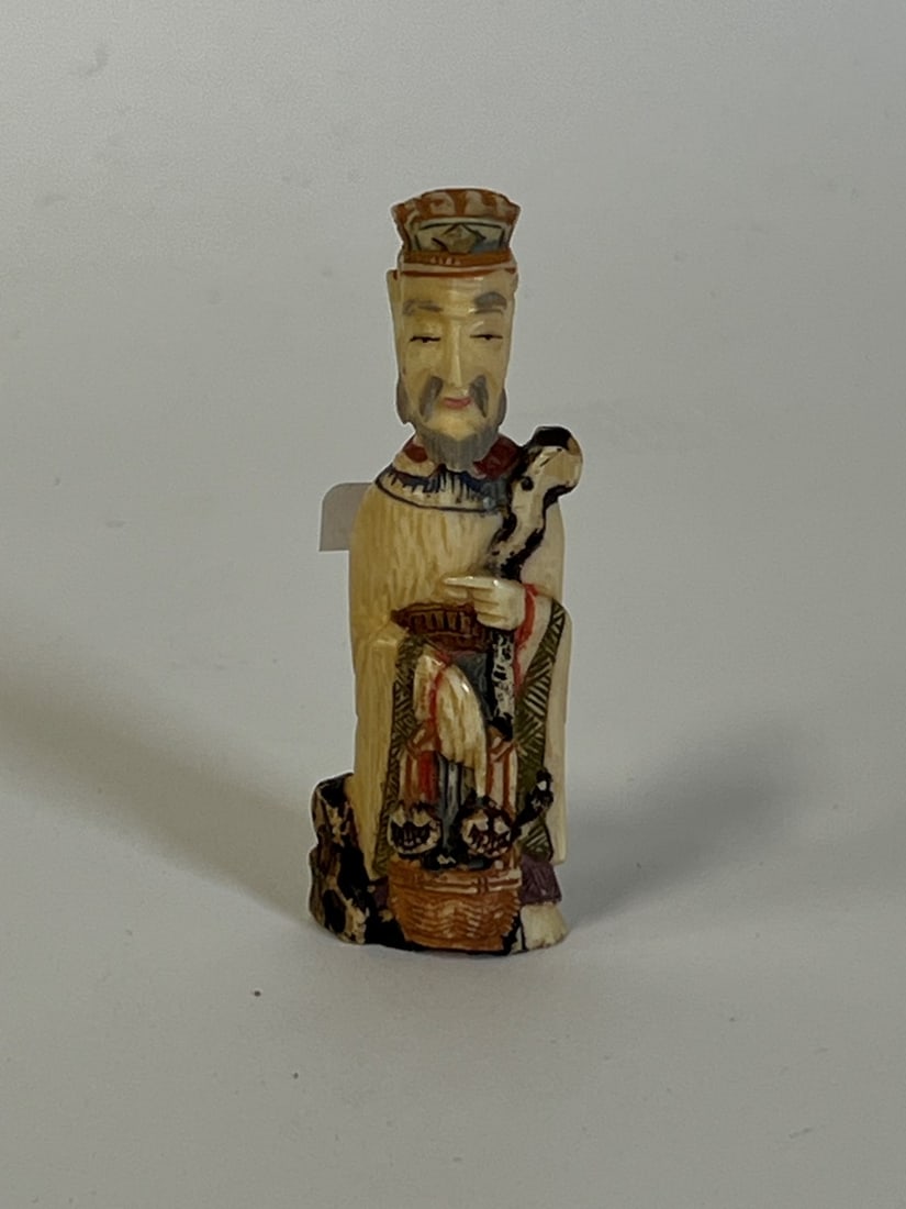 Antique Japamese Scrimshaw Figural Snuff Bottle: Ornately polychromed. Minor flake at the underside. 3 1/4" H