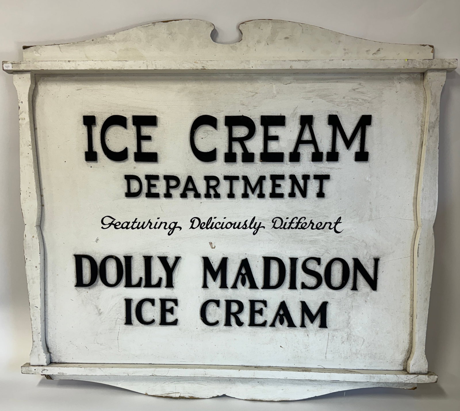 Dolly Madison Ice Cream Sign: Ice Cream Department. Featuring Deliciously Different Dolly Madison Ice Cream For the most part , black raised letters applied onto white painted wooden background 36"H x 40"
