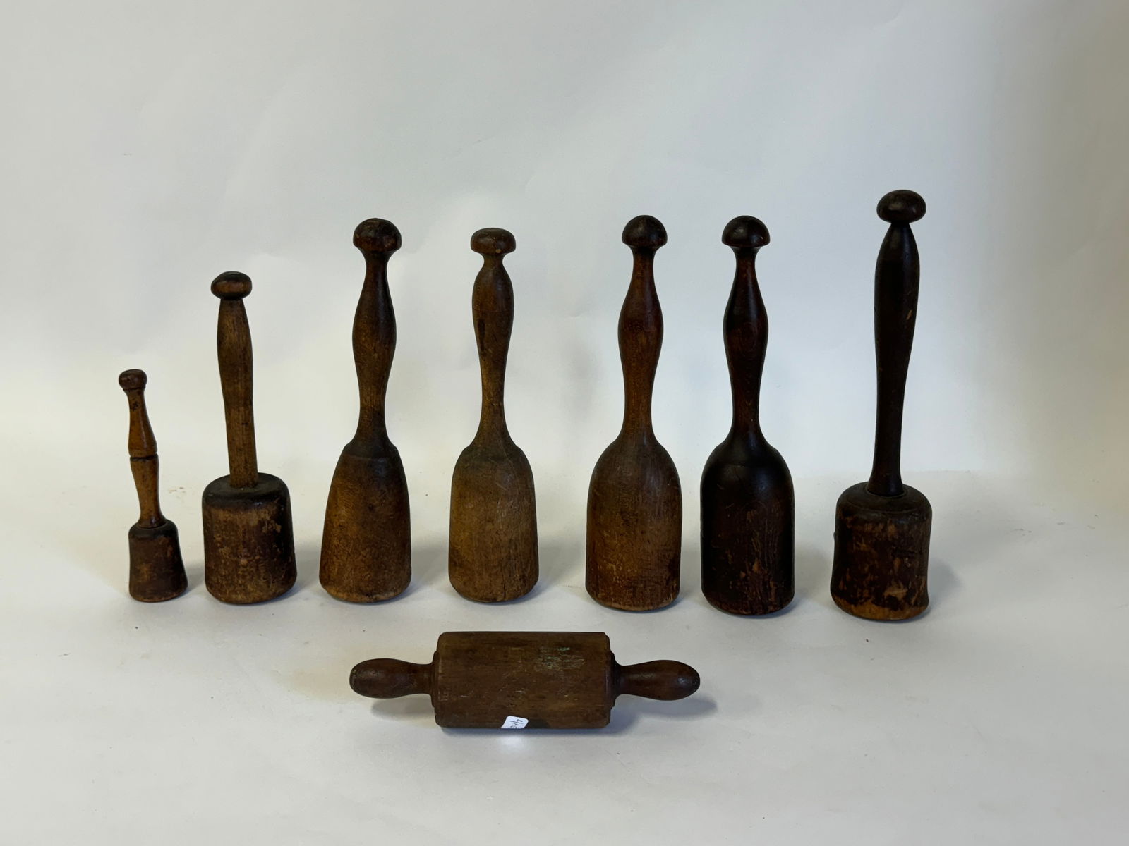 Primitive Antique Wood Mashers Plus a Roller (8): Seven mashers and one roller 11 34"H to 6 12"H (the mashers) and roller is 8" W