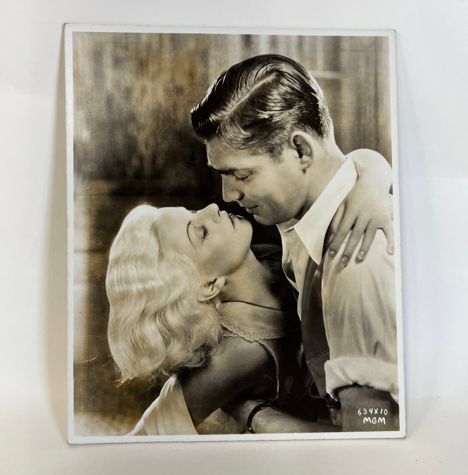 MGM Studio Clark Gable-Jean Harlow Photo: On cardboard. MGM Issued. Marked MGM 634X lower right. 8 x 10