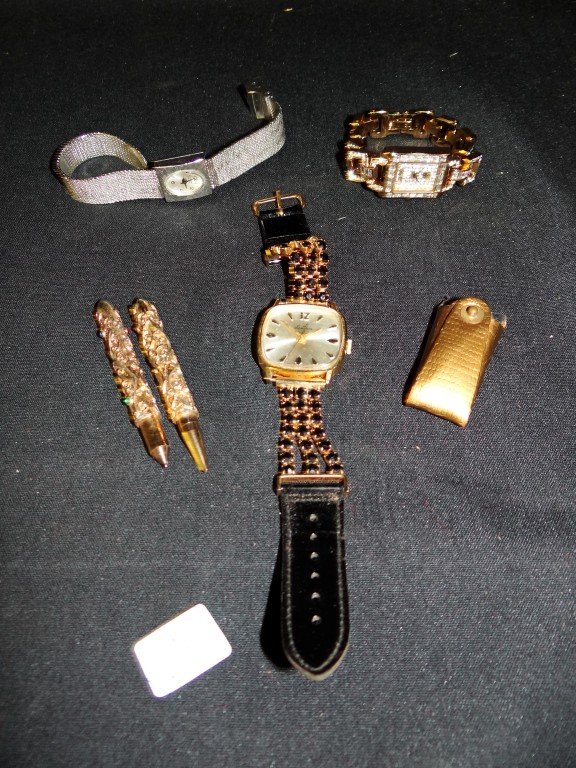 Three Watches & a Purse Set: The lot is comprised of three watches, all costume jewelry and a fancy pen and pencil purse set.