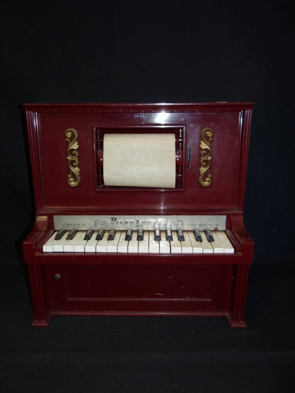 PianoLodeon by J. Chien: Plastic Cased. Keys in working condition. Rolls, some in original boxes (6)