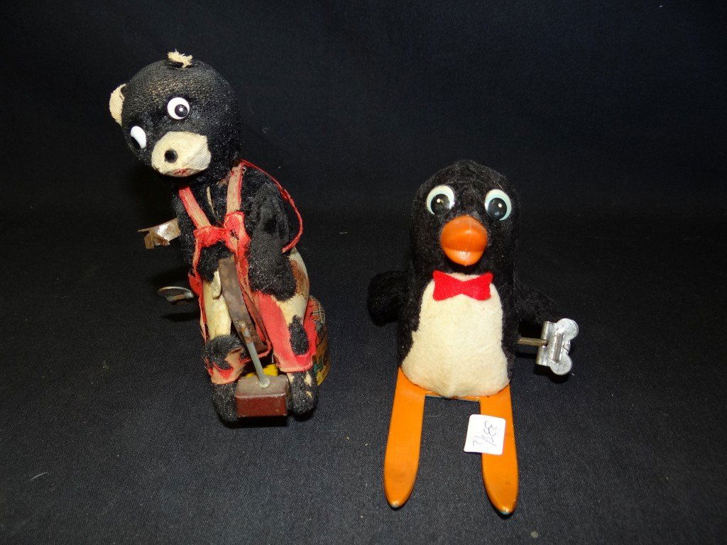 Two Wind Up Toys: A penguin on skies and a shoemaker toy (as is); 4.5in. - 6in. H.