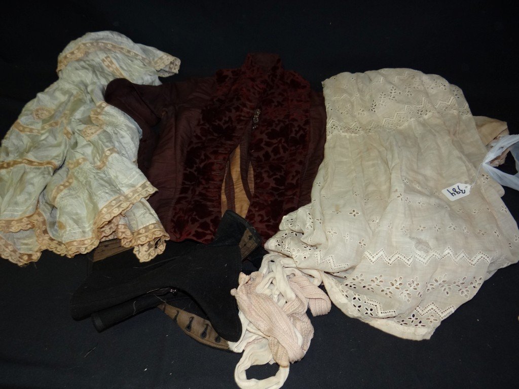 Lot of Victorian Vintage Clothes: The lot includes a silk and lace Victorian top; a velvet and satin bodice; a pair of high button shoe covers; a pair of forearm and upper hand covers and an eyelet lawn dress.