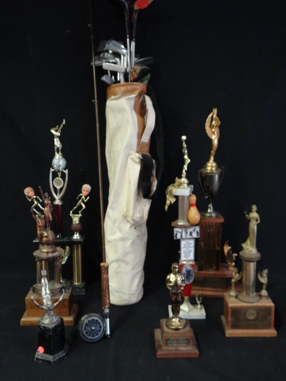 Sporting Lot: An antique fishing reel, golf clubs and sporting trophies(10in. - 28.5in.) in the lot