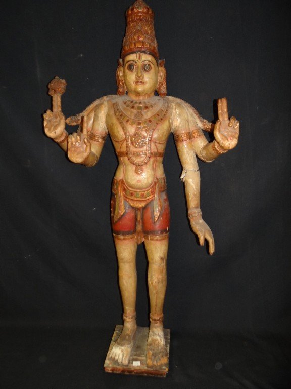 Thai wood carved multi armed figure: Polychromed and gilt wood carved figure of a multi armed Diety; 48in. H. x 21in. (as is)