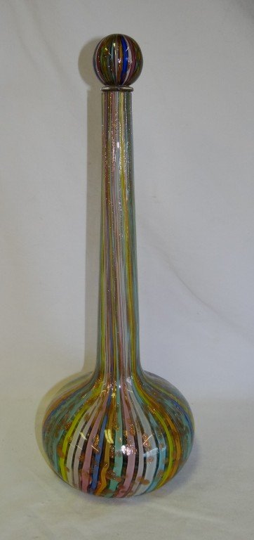 Venini Murano glass decanter: Venini Italian glass decanter with stopper. Multi colored striped design with gold spot inclusions at the base; 17.5in. H.