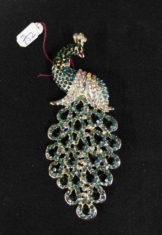 Large costume brooch: Costume brooch. Peacock form. Set with multi colored stones; 4.75in. H.