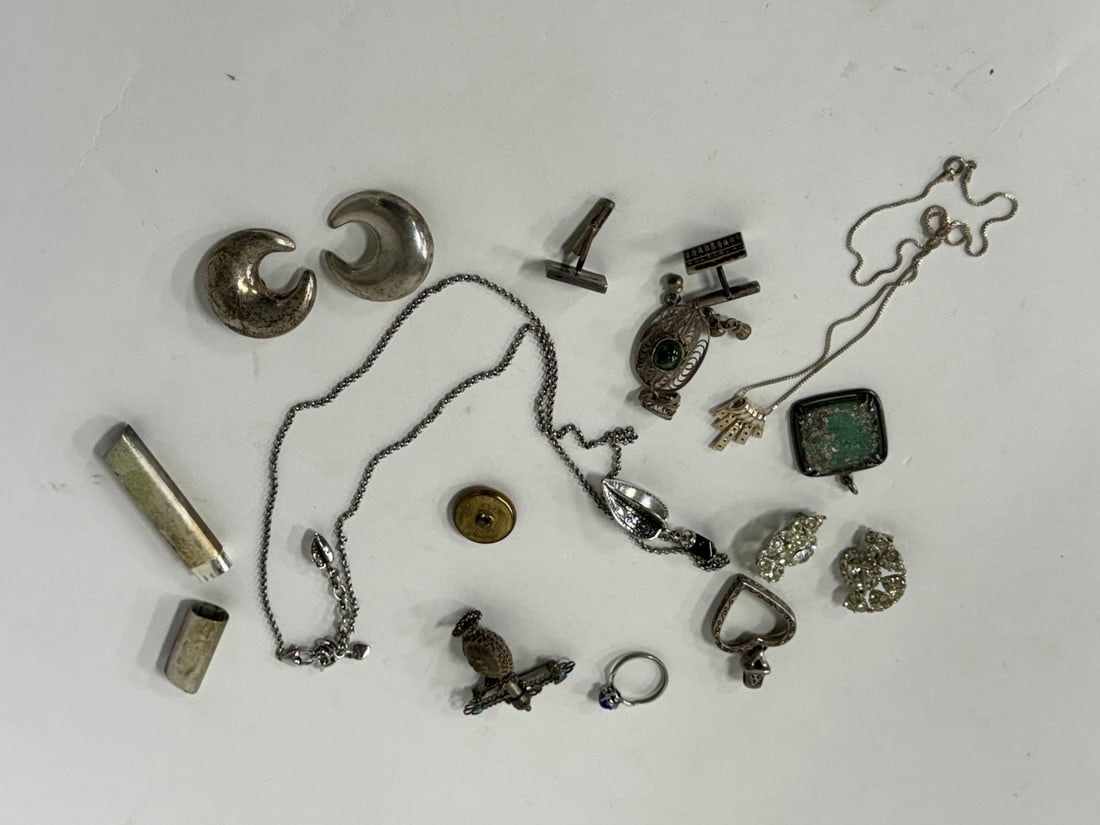 Dealer's Lot of Vintage Jewelry inc. Sterling(17): Includes large moon shaped sterling silver earrings, marked (clip) ; unusual abacus sterling silver earrings marked; Persian ornate pendant ; other necklaces; pendants; button; pr. 50's matched rhines