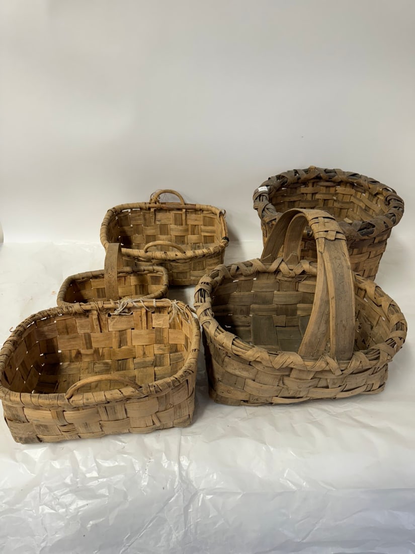 Five(5) Old Baskets: Miscellaneous lot of reeded baskets; various sizes