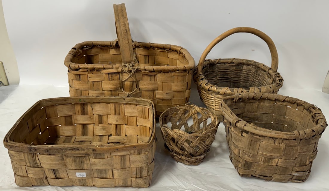 Five(5) Old Baskets: Miscellaneous lot of reeded baskets; various sizes